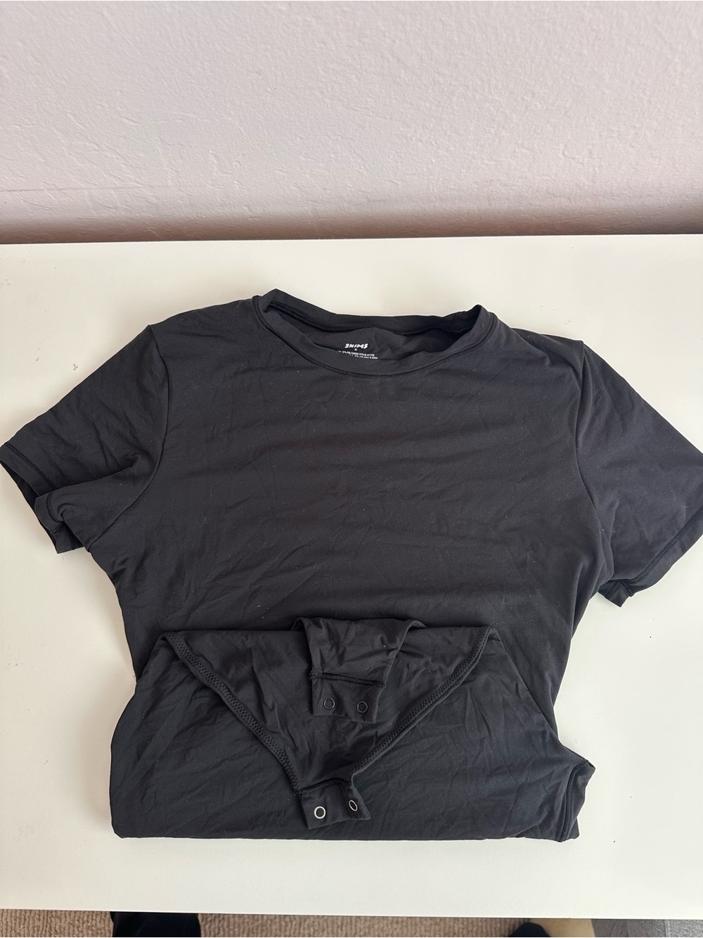SKIMS Black Short Sleeve Tee Bodysuit fits everybody